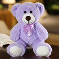 Urso de pelúcia fofo e colorido com gravata borboleta.